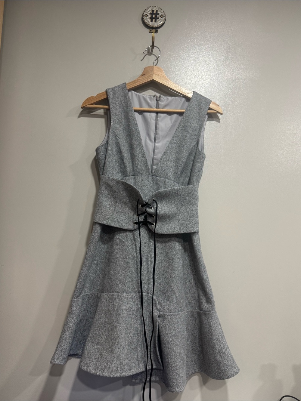 Everleigh peplum style dress  with lace-up corset belt.